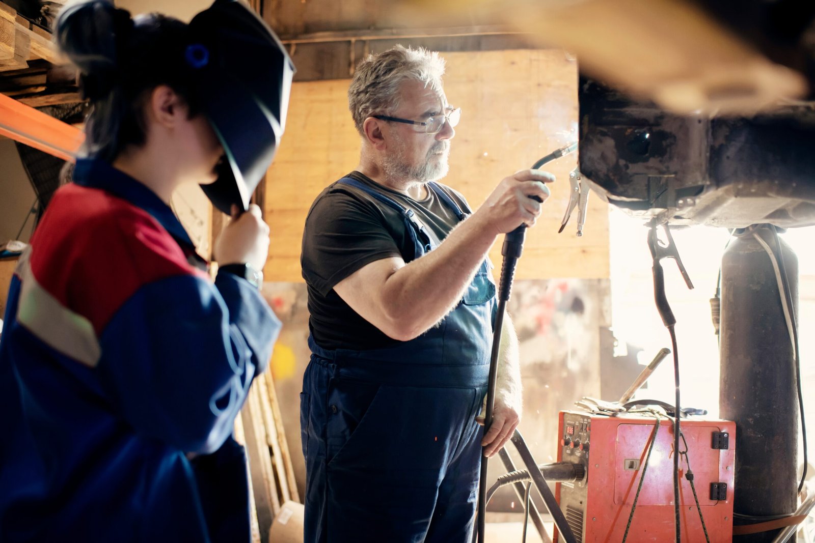 daughter-helps-father-professional-car-mechanic-2025-01-08-02-35-47-utc